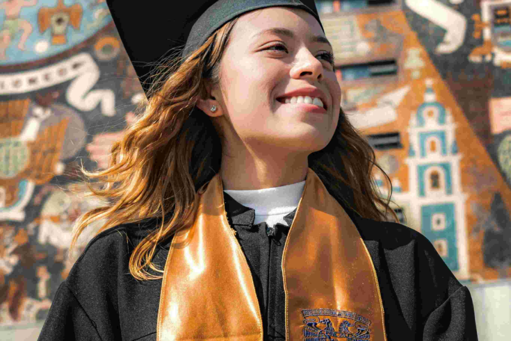 a girl smilling because she done graduation online