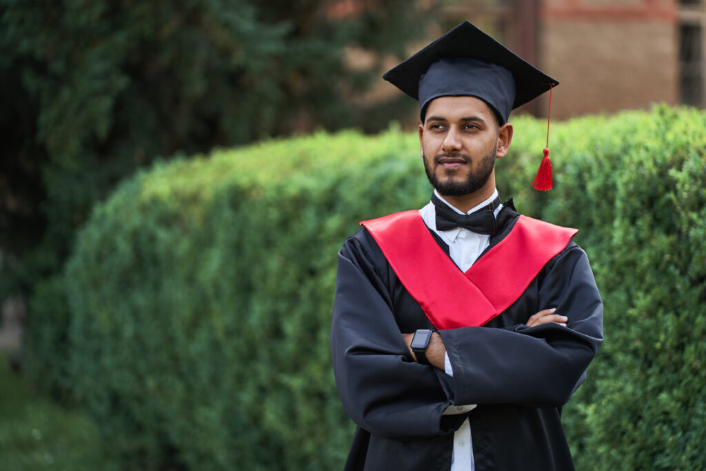 MBA postgraduate student wearing graduation cap and gown